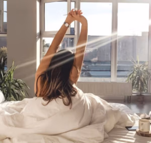 Person feeling energized with molecular energy particles representing increased NAD⁺ levels