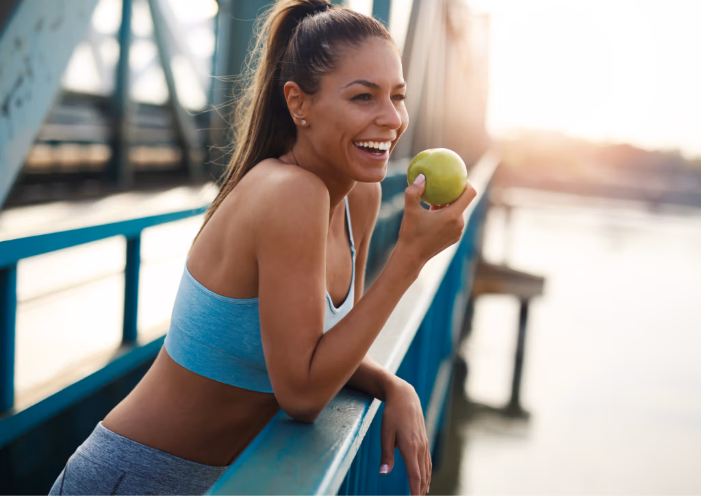 Fit_woman_eating_apple_NAD_Labs
